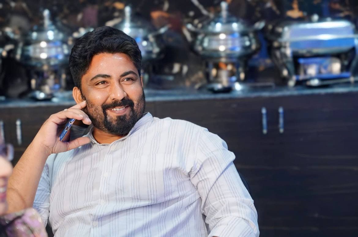 Dheeraj on a call while coordinating a live event